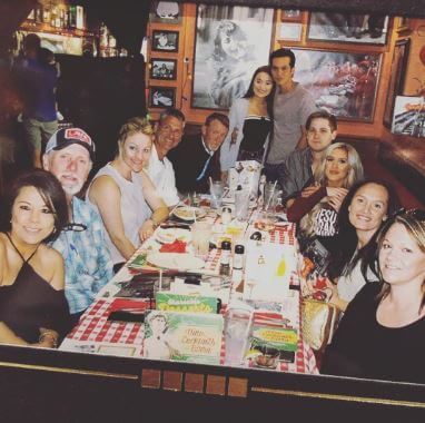 Sydney Becnel and Laine Hardy having dinner with both their parents.